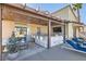 Outdoor kitchen featuring a grill, bar seating, and a covered patio for relaxation and entertaining at 720 Camino La Paz, Henderson, NV 89012