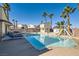 Backyard featuring a large pool, waterslide, treehouse, and lounge chairs for a relaxing and fun outdoor experience at 720 Camino La Paz, Henderson, NV 89012