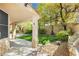 The spacious backyard offers an outdoor kitchen, pavers, turf and multiple seating areas at 7427 Tomahawk Bend Ave, Las Vegas, NV 89113