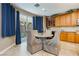 Breakfast nook with a view of the backyard through sliding glass doors at 7427 Tomahawk Bend Ave, Las Vegas, NV 89113