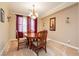 Dining room with a wood table, chairs, and natural light at 7427 Tomahawk Bend Ave, Las Vegas, NV 89113
