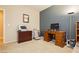 Home office with a wooden desk, printer, and a chair, perfect for a productive work environment at 7427 Tomahawk Bend Ave, Las Vegas, NV 89113