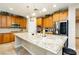 Gourmet kitchen with stainless steel appliances, granite countertops, and custom cabinetry at 7427 Tomahawk Bend Ave, Las Vegas, NV 89113
