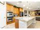 View of kitchen featuring stainless steel appliances, oven and large center island at 7427 Tomahawk Bend Ave, Las Vegas, NV 89113