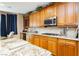 View of kitchen featuring granite countertops, stainless appliances, and breakfast nook at 7427 Tomahawk Bend Ave, Las Vegas, NV 89113