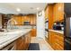 Spacious kitchen featuring stainless steel appliances, stone countertops and light wood cabinetry at 7427 Tomahawk Bend Ave, Las Vegas, NV 89113
