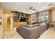 Living room features a built-in bookcase and a large sofa for seating at 7427 Tomahawk Bend Ave, Las Vegas, NV 89113