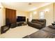 Inviting living room featuring a sleek entertainment center and comfortable leather seating at 7427 Tomahawk Bend Ave, Las Vegas, NV 89113