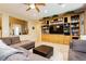 View of the living room featuring a built-in bookcase and comfortable seating at 7427 Tomahawk Bend Ave, Las Vegas, NV 89113