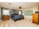 Spacious main bedroom featuring neutral walls, carpet flooring, ceiling fan and natural light at 7427 Tomahawk Bend Ave, Las Vegas, NV 89113