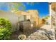 The outdoor kitchen has a stone surround grill, providing a luxurious grilling experience at 7427 Tomahawk Bend Ave, Las Vegas, NV 89113