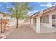 The backyard patio has a covered area and low-maintenance gravel landscaping at 7608 Sierra Paseo Ln, Las Vegas, NV 89128