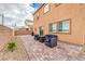 Home's backyard including a patio, outdoor seating, gravel, and minimal landscaping for easy upkeep at 7948 Eastern Elk St, Las Vegas, NV 89149