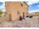 Home's backyard featuring a brick-paved patio, grill, outdoor seating, and low-maintenance landscaping at 7948 Eastern Elk St, Las Vegas, NV 89149