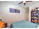 Bedroom featuring a ceiling fan and a painting over the bed at 7948 Eastern Elk St, Las Vegas, NV 89149