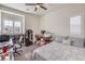 Versatile bedroom space with a desk, chair, and bed, perfect for a home office or guest room at 7948 Eastern Elk St, Las Vegas, NV 89149