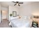 Bright bedroom with plush carpeting, a queen bed, dresser, and decor for a comfortable living space at 7948 Eastern Elk St, Las Vegas, NV 89149