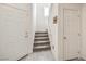 Hallway features tile flooring, multiple doors, and a staircase leading to the upper level at 7948 Eastern Elk St, Las Vegas, NV 89149