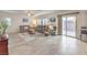 Open living room with a sliding glass door to the outdoor space and contemporary furnishings at 7948 Eastern Elk St, Las Vegas, NV 89149