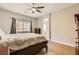 View of the main bedroom showcasing the bed, furniture, and ensuite bathroom at 813 Royal Elm Ln, Las Vegas, NV 89144