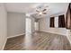View of a bedroom showcasing vaulted ceilings, wood-look floors and neutral paint at 9505 Belgate Ct, Las Vegas, NV 89129