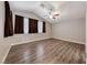 Spacious bedroom with vaulted ceilings, wood-look floors and neutral paint at 9505 Belgate Ct, Las Vegas, NV 89129