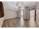 Large bedroom with vaulted ceilings, wood-look floors, and ensuite bathroom access at 9505 Belgate Ct, Las Vegas, NV 89129