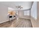 Spacious living area with hardwood floors, a ceiling fan, and lots of natural light from the windows at 9505 Belgate Ct, Las Vegas, NV 89129