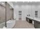Bathroom featuring tile flooring, walk-in shower, tub, double vanity and neutral colored tiles at 10739 Agate Cliffs Ave, Las Vegas, NV 89135