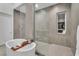 Modern bathroom with a walk-in shower and soaking tub at 10739 Agate Cliffs Ave, Las Vegas, NV 89135