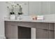 Bathroom featuring a vanity with double sinks, white countertops and gray cabinets at 10739 Agate Cliffs Ave, Las Vegas, NV 89135