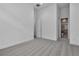 Bright bedroom showcasing neutral walls, plush carpet, and access to bathroom with glass shower at 10739 Agate Cliffs Ave, Las Vegas, NV 89135