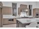 Bright, modern kitchen with stainless steel appliances, ample cabinet space, and sleek countertops at 10739 Agate Cliffs Ave, Las Vegas, NV 89135