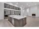 Bright kitchen showcases a large island, sleek countertops, and modern appliances at 10739 Agate Cliffs Ave, Las Vegas, NV 89135