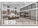 Modern, spacious kitchen with a large island, bar seating, stainless steel appliances, and plenty of natural light at 10739 Agate Cliffs Ave, Las Vegas, NV 89135