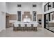 A modern kitchen with an island with seating, stainless steel appliances and a high ceiling at 10739 Agate Cliffs Ave, Las Vegas, NV 89135