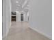 Bright living room features neutral tile flooring, recessed lighting and modern doors at 10739 Agate Cliffs Ave, Las Vegas, NV 89135