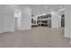 Bright, open living area features modern flooring and transitions seamlessly into the kitchen at 10739 Agate Cliffs Ave, Las Vegas, NV 89135