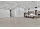 Open-concept living space showcasing kitchen with island and modern fixtures in neutral tones at 10739 Agate Cliffs Ave, Las Vegas, NV 89135