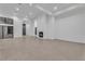 Expansive living area showcasing a modern fireplace, large windows, and tiled flooring at 10739 Agate Cliffs Ave, Las Vegas, NV 89135