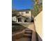 Backyard view with patio, steps, and drought tolerant yard at 10799 Flame Vine Ct, Las Vegas, NV 89135