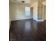 Spacious bedroom featuring wood-look floors and a modern ceiling fan at 10799 Flame Vine Ct, Las Vegas, NV 89135