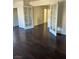 Large bedroom featuring wood-look flooring and a modern ceiling fan at 10799 Flame Vine Ct, Las Vegas, NV 89135