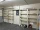 This garage features built-in shelving on the back wall for storage and organization at 10799 Flame Vine Ct, Las Vegas, NV 89135