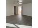 A spacious main bedroom featuring wood-look floors and an attached bathroom at 10799 Flame Vine Ct, Las Vegas, NV 89135