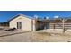 Spacious backyard featuring dirt, a sliding glass door, pergola, and exterior walls at 1301 Madison Ave, Las Vegas, NV 89106