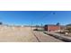 Spacious backyard featuring dirt, a storage shed and exterior walls at 1301 Madison Ave, Las Vegas, NV 89106