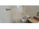 Bathroom featuring a shower-tub combo, toilet, and vanity with a light brown countertop at 1301 Madison Ave, Las Vegas, NV 89106