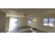 Bedroom with a ceiling fan, windows, and sliding glass doors for natural light and ventilation at 1301 Madison Ave, Las Vegas, NV 89106