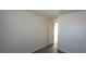 Bright bedroom featuring wood-look flooring and a door leading to another room at 1301 Madison Ave, Las Vegas, NV 89106